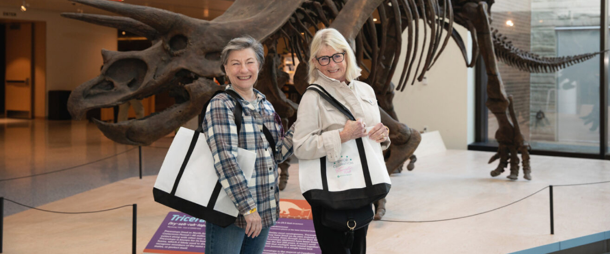 Two senior women posing for a photo at the Cleveland Museum of Natural History.