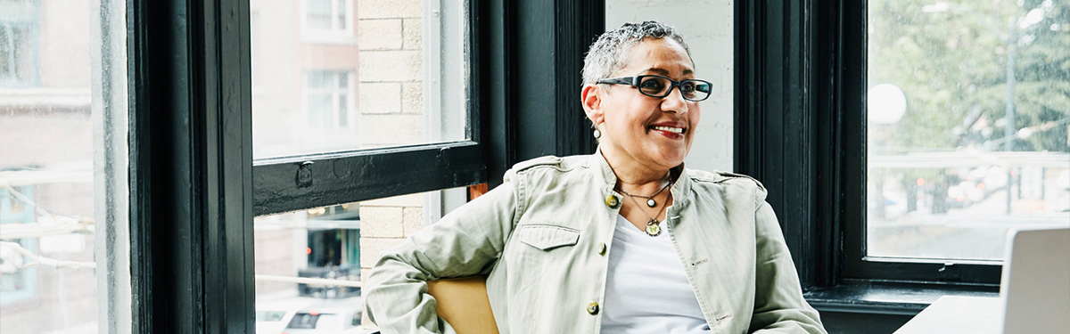 Photo of woman sitting at desk